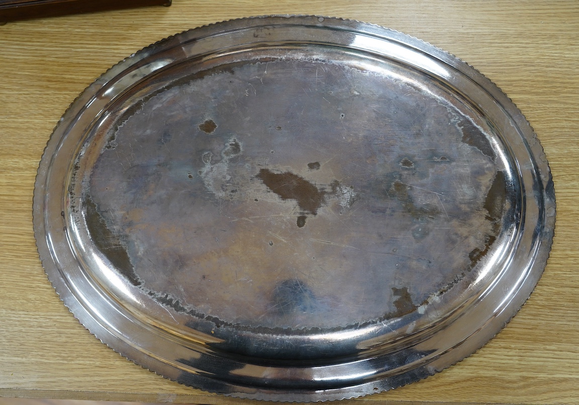 Two 19th century Old Sheffield plate oval meat plates, with gadrooned borders, largest 58.2cm. Condition - plate worn and scratched